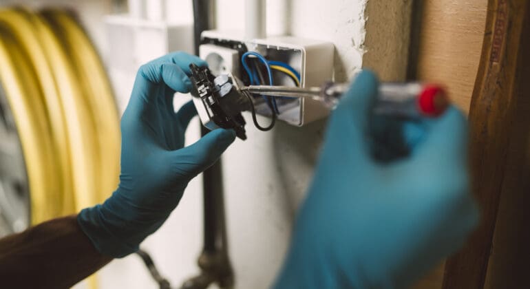 Detail of a man working on an electrical installation